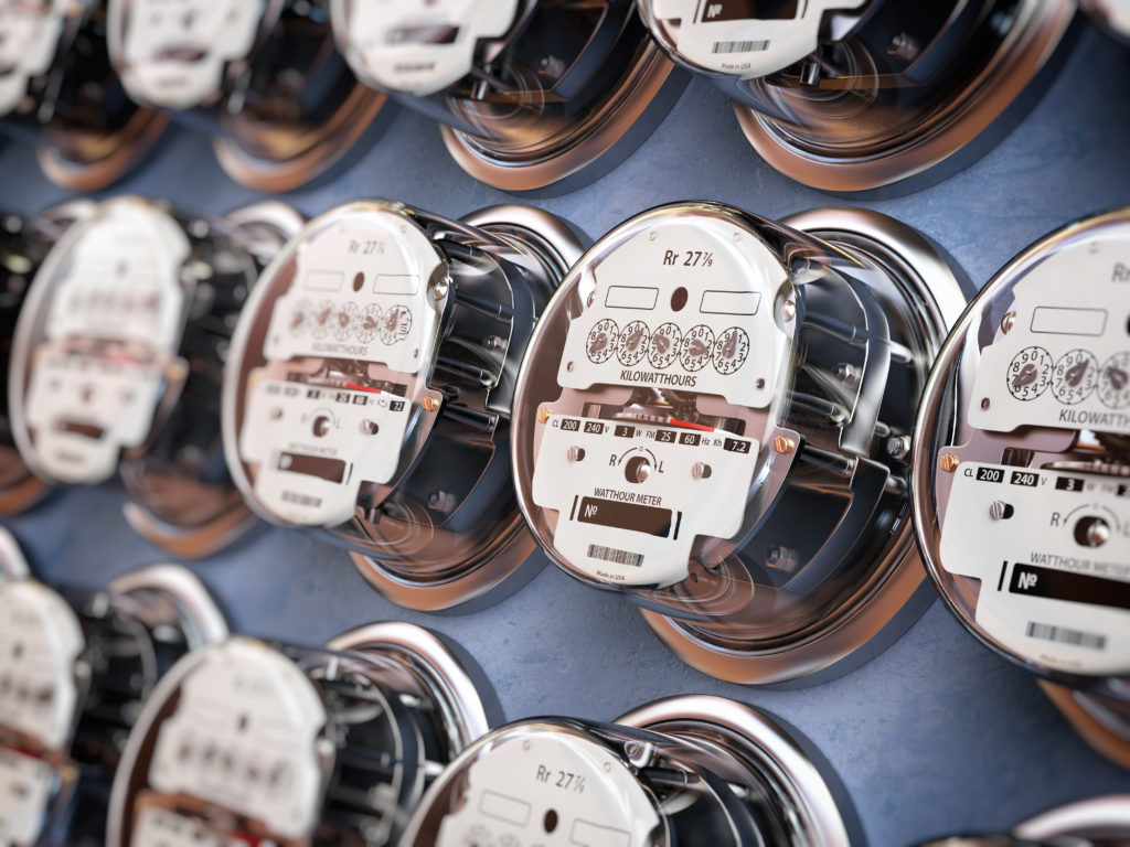 Electric meters in a row measuring power use.